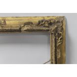 AN ANTIQUE PICTURE FRAME WITH DECORATIVE MOULDING, frame size approx. 59.5 cm x 69 cm aperture 48.