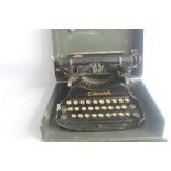 A CORONA FOLDING PORTABLE TYPEWRITER IN FITTED CARRY CASE