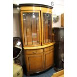 AN EARLY 20TH CENTURY BURR WALNUT BOW FRONTED DISPLAY BOOKCASE, the upper section with twin astragel