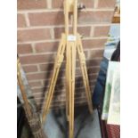 A WOODEN ARTISTS EASEL