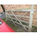 A WOODEN FIVE BAR GATE