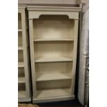 A MODERN PAINTED BOOKCASE