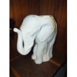 A CERAMIC ELEPHANT SHAPED STICK STAND