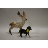 A BESWICK STAG TOGETHER WITH A BESWICK SHETLAND FIGURE