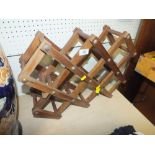 A FOLDING WOODEN WINE RACK