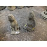 A PAIR OF SMALL MOON GAZING HARE FIGURES