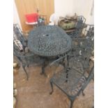 A CAST METAL GREEN GARDEN BENCH WITH SIX CHAIRS