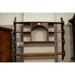 AN OAK OPEN HANGING SHELF