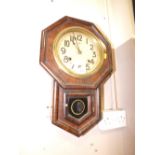 A SIMULATED ROSEWOOD ANTIQUE WALL CLOCK