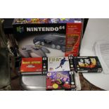 A BOXED NINTENDO 64 CONSOLE AND GAMES TO INCLUDE GOLDEN EYE