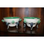 A PAIR OF WEDGWOOD MAJOLICA ELEPHANT FOOTED FRUIT BOWLS A/F