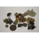 A BAG OF MILITARY BUTTONS & BADGES ETC