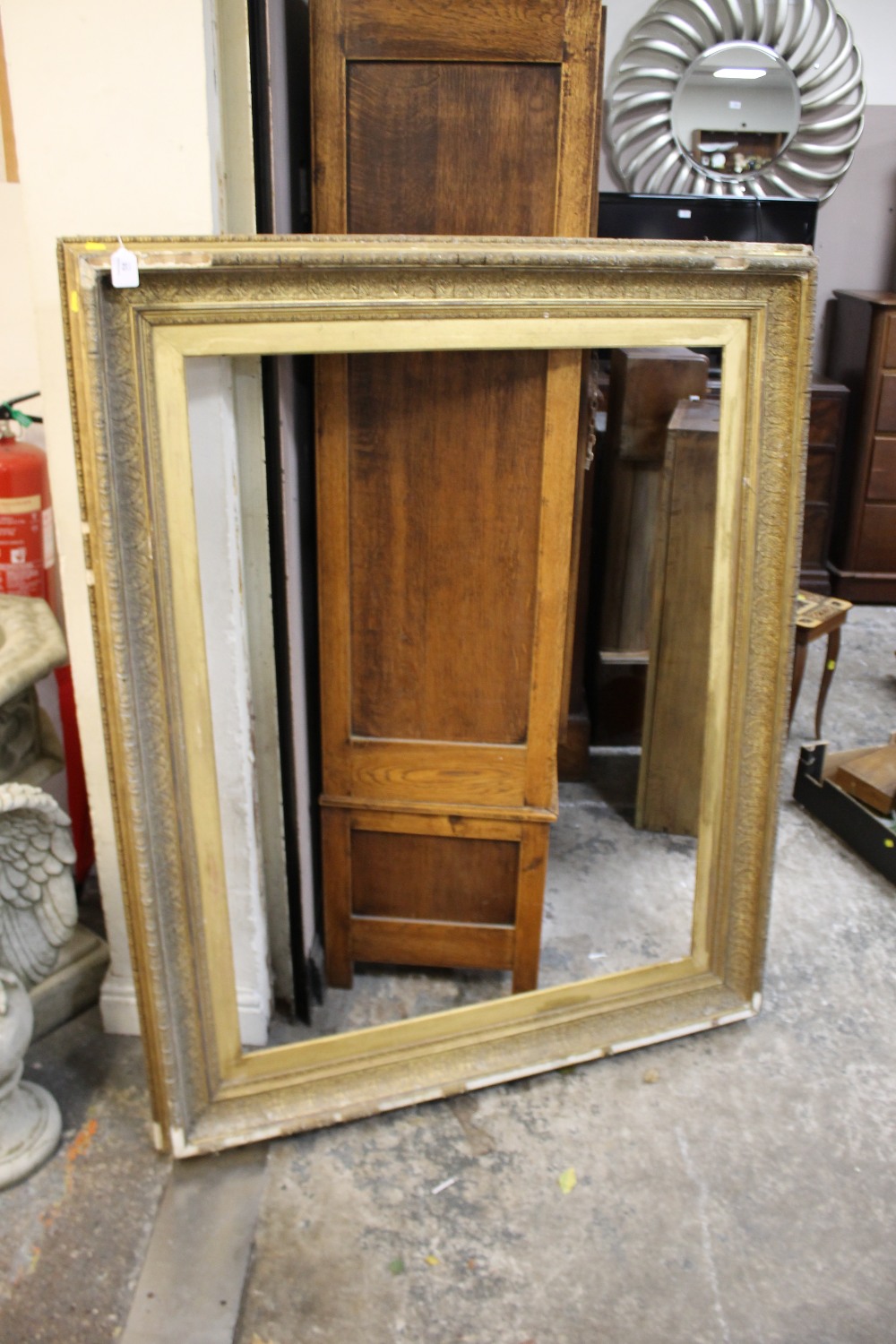 A LARGE 19TH CENTURY GILTWOOD PICTURE FRAME, acanthus moulded detail, rebate 110 x 84 cm