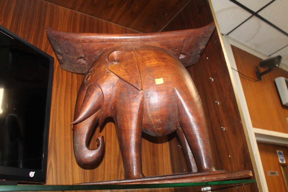 A LARGE ELEPHANT STOOL