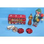 A QUANTITY OF COLLECTABLES TO INCLUDE WIND UP CLOWN TOY, MG BADGES, TIN-PLATED BUS ETC