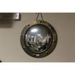 A BRASS PORTHOLE STYLE MIRROR