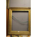 A LARGE GILT FRAME