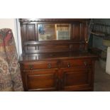 A LARGE OAK MIRROR BACKED SIDEBOARD