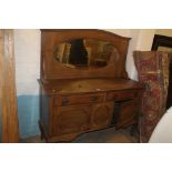 AN OAK MIRROR BACKED SIDEBOARD