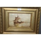 A GILT FRAMED OIL ON BOARD DEPICTING A SHIP AT SEA