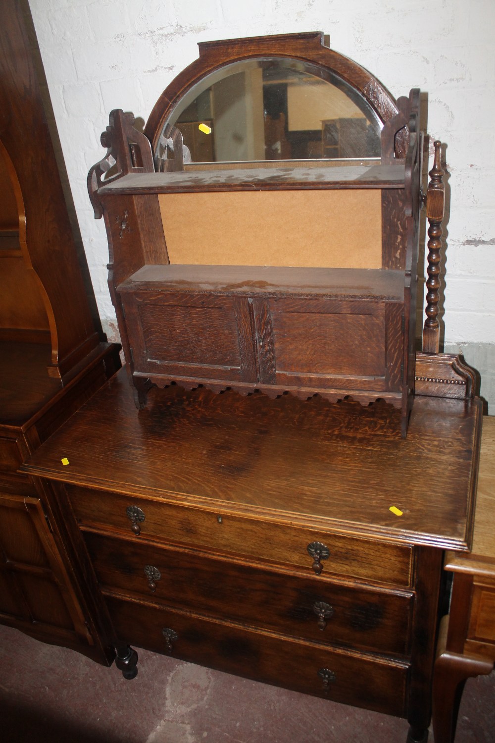 AN OAK DRESSING TABLE TOGETHER WITH A SMALL HANGING CUPBOARD