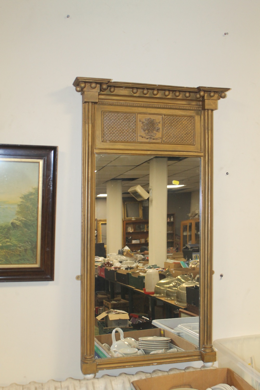 A LARGE OVERMANTEL MIRROR