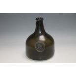 A SEALED BLACK GLASS MALLET WINE BOTTLE, carrying the seal of Sandford Hall, Shropshire, with a good