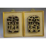 TWO FRAMED ORIENTAL CARVED WOODEN PLAQUES, gilt relief figural images, red background, 21 x 14.3