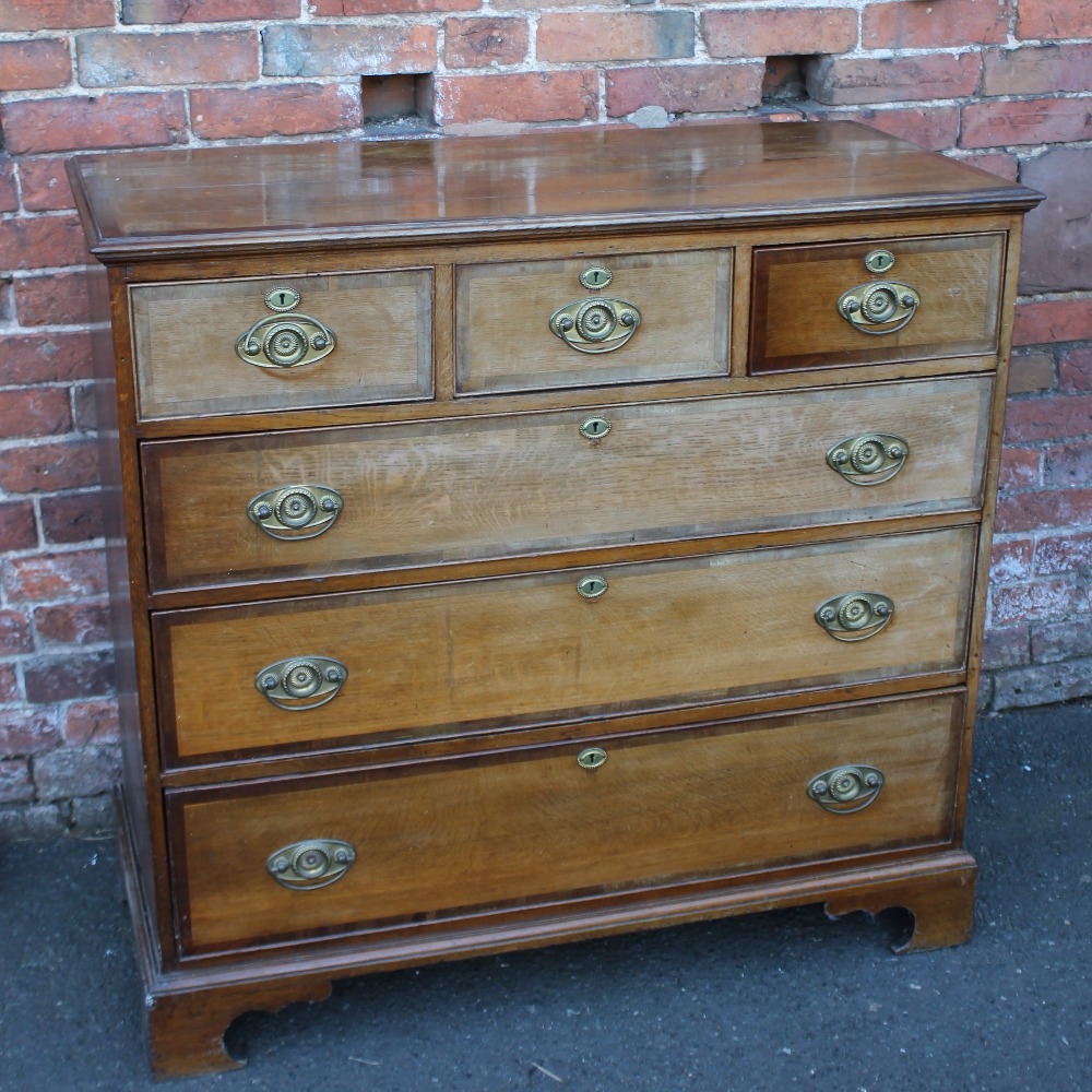 A 19TH CENTURY OAK AND MAHOGANY INLAID AND CROSSBANDED SIX DRAWER CHEST, with three short above