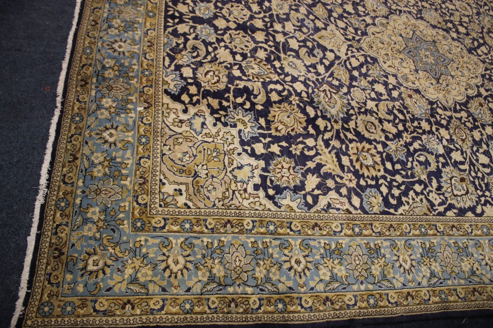 A LARGE 20TH CENTURY IRANIAN WOOLLEN RUG, with an all over pattern on a mainly blue ground, 373 x - Image 2 of 4