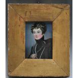 P. A 19th century portrait miniature of a young officer in dress uniform, in gold slip, signed