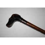A LATE 19TH / EARLY 20TH CENTURY WALKING STICK WITH CARVED DOGS HEAD HANDLE, overall L 81 cm