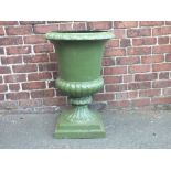 A LARGE CAST IRON CAMPANA SHAPED URN, painted in green, raised on a square stepped base, H 79 cm,