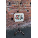 A 19TH CENTURY POLE SCREEN, the rectangular glazed screen with floral needlepoint detail, the
