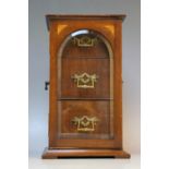 AN EDWARDIAN MAHOGANY INLAID TABLE CABINET, with satinwood inlaid detail, the glazed door opening to