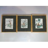 A SET OF THREE FRAMED ORIENTAL CERAMIC PLAQUES / TILES, each having hand painted female figural