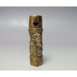 AN UNUSUAL BRASS MATCH STRIKE IN THE FORM OF A WHISTLE, having equestrian style decoration to one