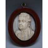 A LATE 19TH CENTURY OVAL MINIATURE CARVED IVORY BUST OF EDWARD GIBBON, author of 'The Decline & Fall