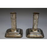 A PAIR OF HALLMARKED SILVER 'CANNON BARREL' CANDLESTICKS - BIRMINGHAM 1905