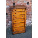 A 19TH CENTURY OAK WELLINGTON CHEST, with graduated drawers and locking bar, no key, H 103 cm, W