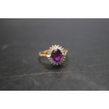 AN 18CT AMETHYST AND DIAMOND RING, ring size R