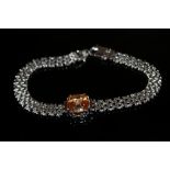 A 925 SILVER PADPARADSCHA LATTICE BRACELET, the central stone being claw set in silver, approx