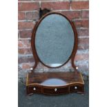 A 19TH CENTURY MAHOGANY DRESSING MIRROR, the oval mirror held on shaped slender supports, the