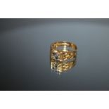 A HALLMARKED 18 CARAT GOLD RING, set with two small sapphires and two small diamonds on a pierced
