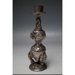A SUB CONTINENTAL CANDLESTICK, decorated with elephants, H 19 cm
