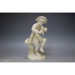 A ROYAL WORCESTER FIGURE OF A BOY PLAYING A CLARINET, model number 1070 for Hadley Reg No 23324