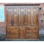 A 19TH CENTURY OAK HOUSEKEEPERS CUPBOARD, the upper section with five panelled doors, the lower