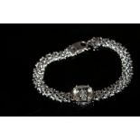 A SERENITE AND DIAMOND SILVER BRACELET, having a cushion cut serenite of approx 4.33 carats,