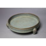 A CELADON FOOTED SHALLOW DISH, Dia 15 cm
