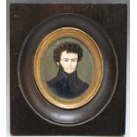 A LATE 19TH / EARLY 20TH CENTURY OVAL MINIATURE PORTRAIT STUDY OF A MAN IN A HIGH COLLARED BLUE